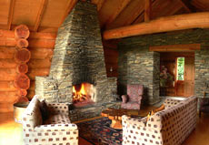 Peel Forest Lodge open stone fireplace in the lounge, completes the picture of luxury